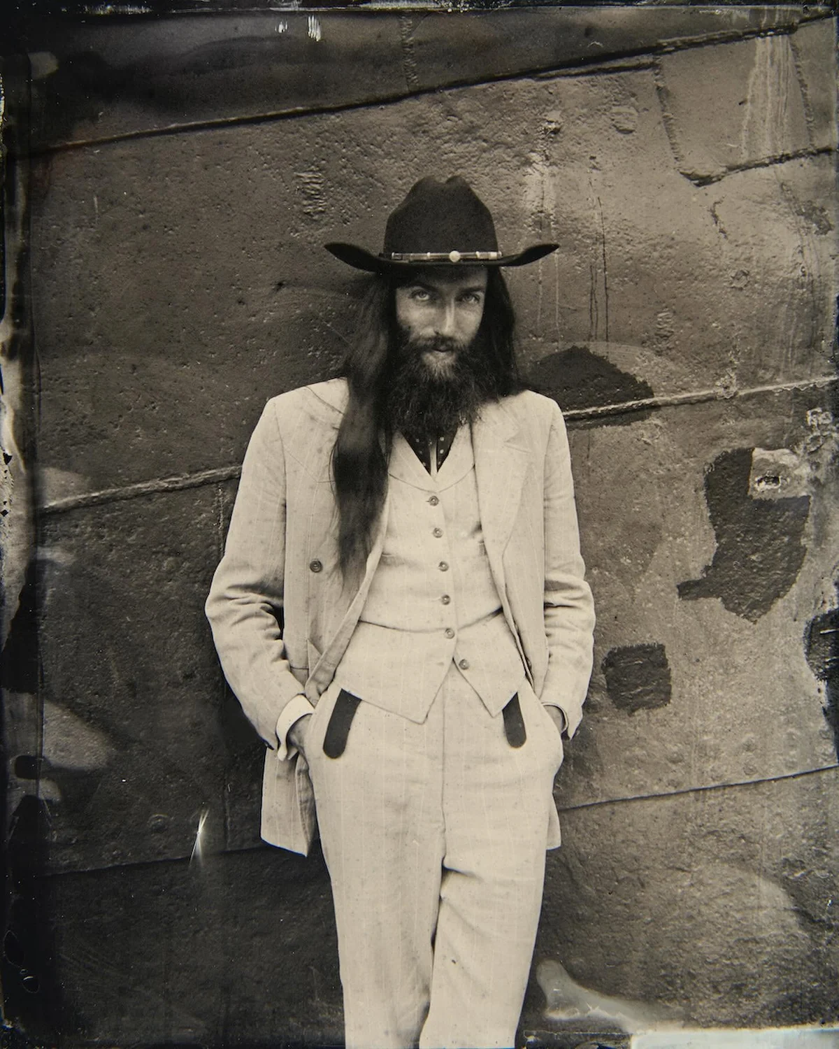 Wet-collodion tintype of Stewart Vickers in a pale three-piece suit and wide-brimmed hat
